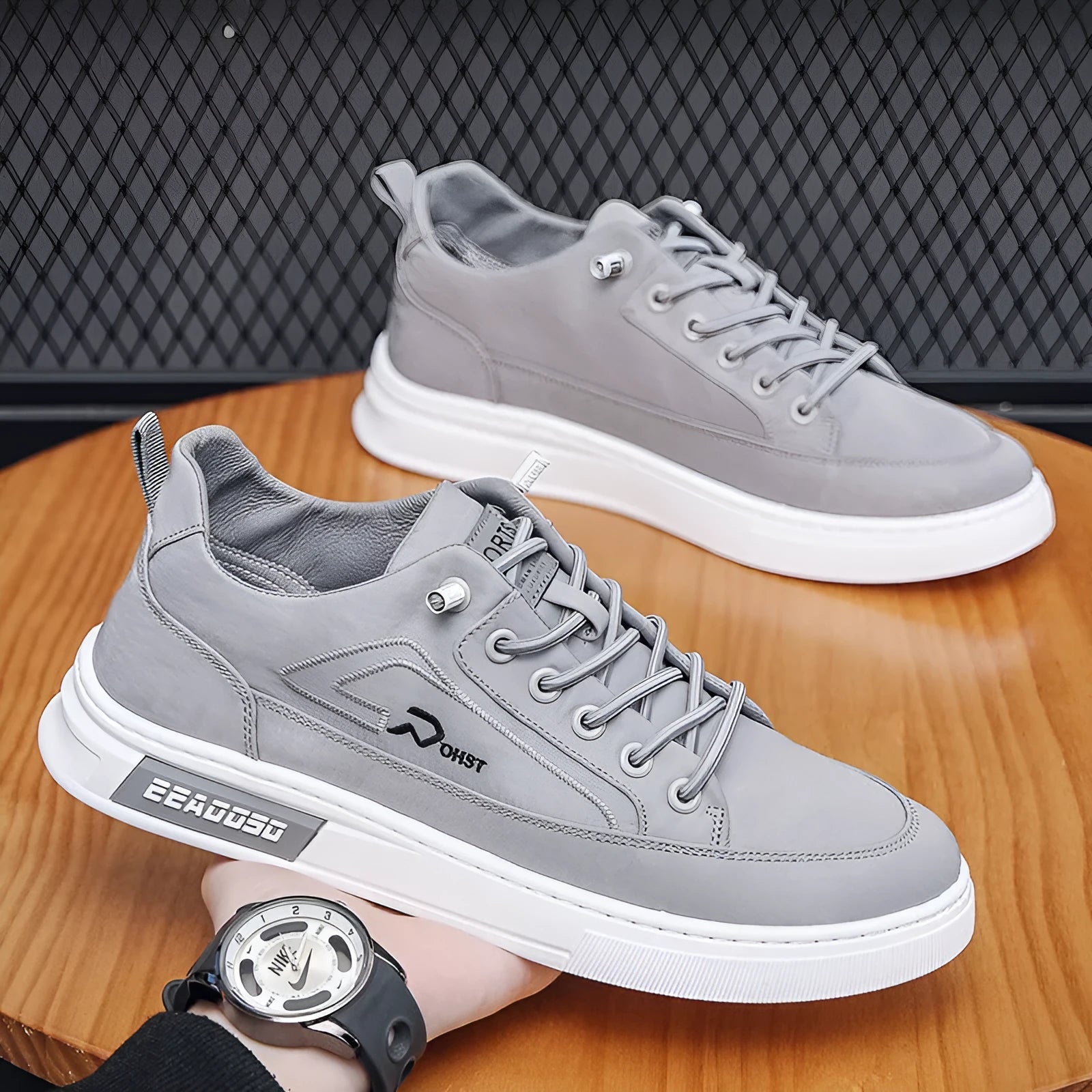 Grey men's canvas casual shoes with leather lining and rubber sole showing stitching details