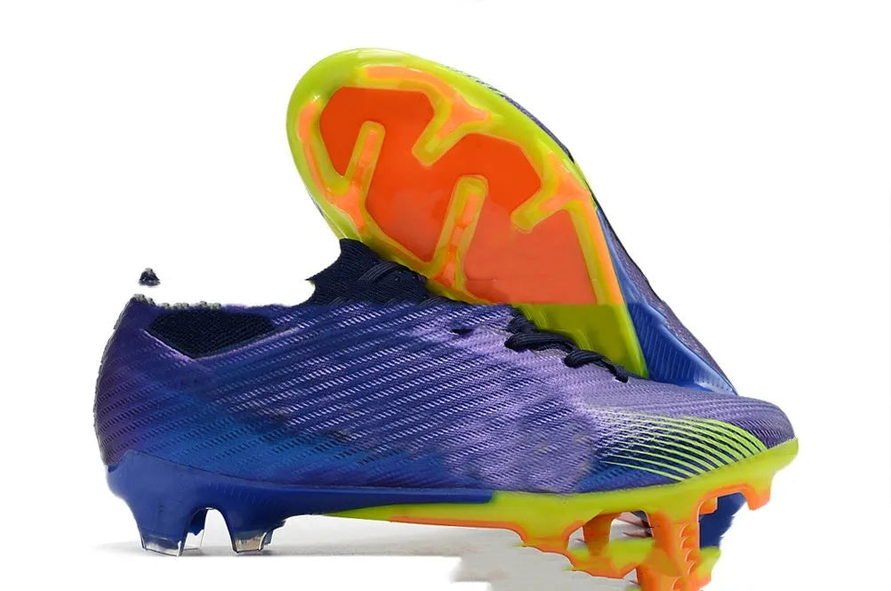 Men's knitted blue and white football shoes with FG studs and a lace-up front.