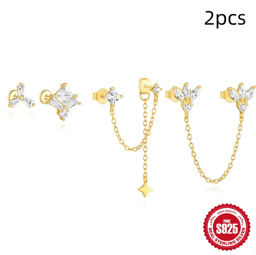 Golden geometric S925 sterling silver stud earrings with zircon inlays, showing clover, crown, and chain horse eye designs.