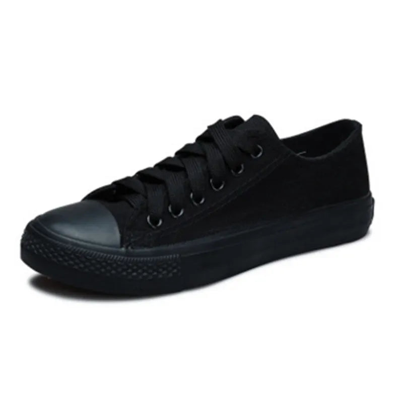 Women's casual canvas shoes in solid black, white-black, or white-red colour options
