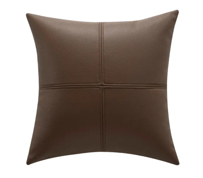 Soft cowhide leather pillow cover in a solid colour on a sofa.