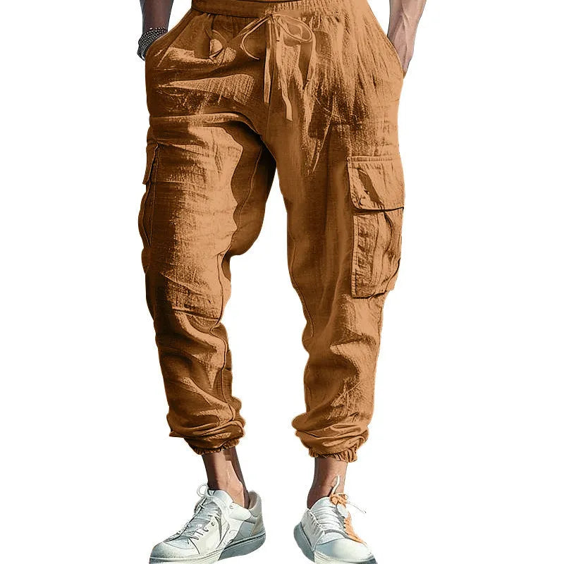 Man wearing khaki linen casual trousers with ankle-tied legs and multiple pockets.