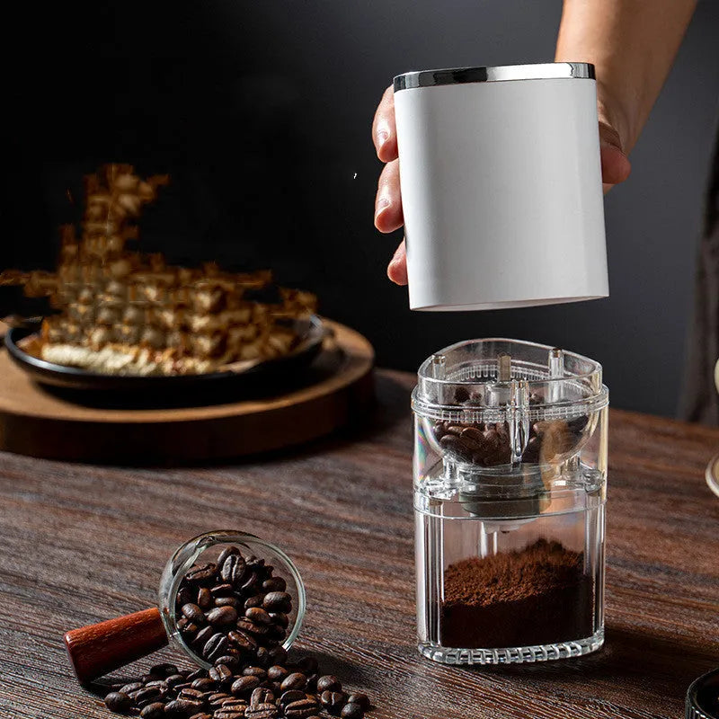 Electric coffee grinder with ceramic burr, USB rechargeable, portable, in frosted white on dark background