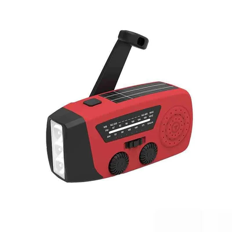 Red rechargeable hand torch with AM/FM radio, wrist strap, and USB charging interface