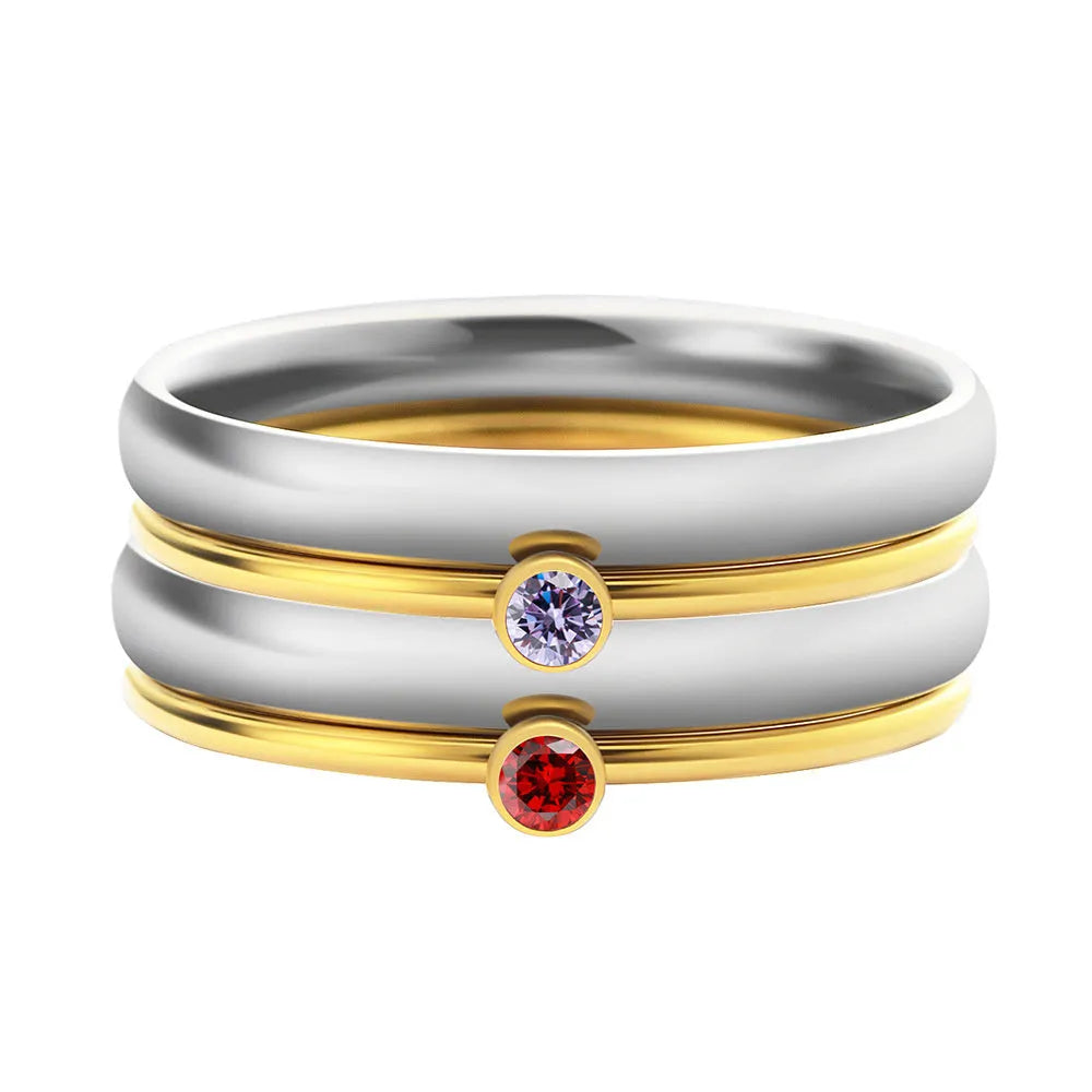 Geometric titanium steel ring with engraved December birthstone design on a hand.