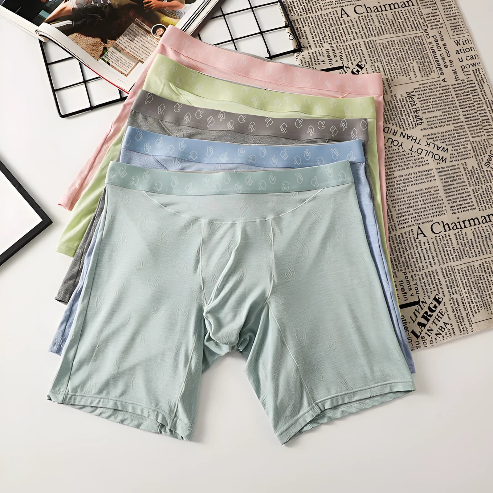 Men's lengthened modal ice silk boxer shorts with hip lifting in blue, front view