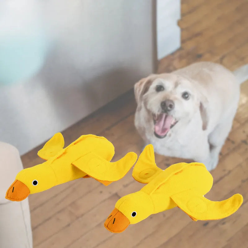 Yellow teddy bear duck plush dog toy with squeaker and treat holes.