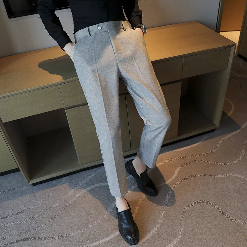 Retro brown straight leg corduroy trousers with elastic waistband laid flat.