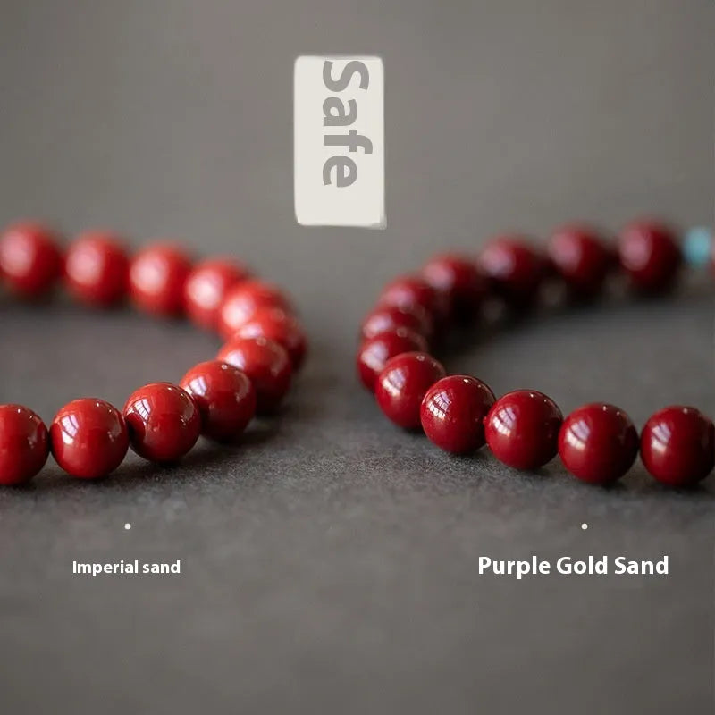 Purple gold sand cinnabar and Hetian jade geometric ellipse bead unisex bracelet on a wrist.
