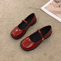 Women's solid colour flat shoes with round toe in red, black, and grey options