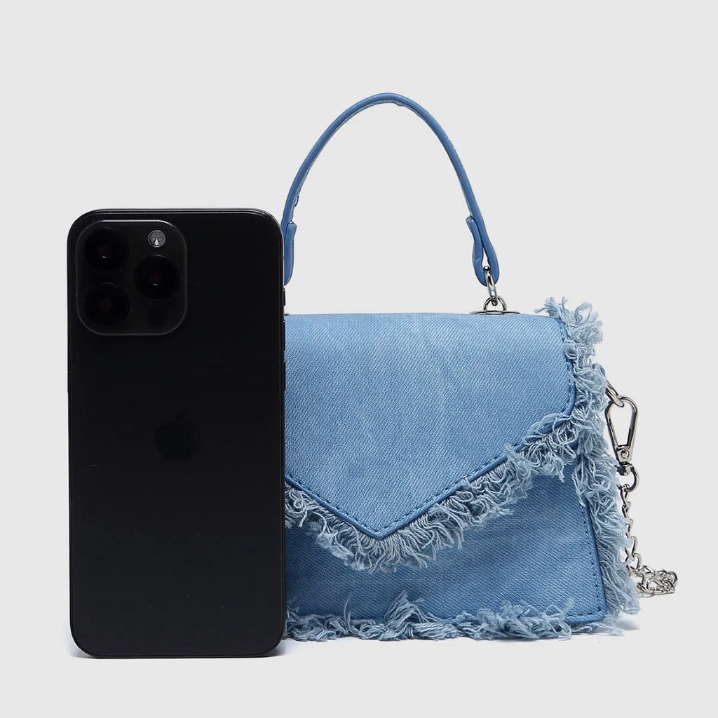 Retro tassel bag mini crossbody bag in denim blue colour, PU material, with tassel detail and crossbody strap.