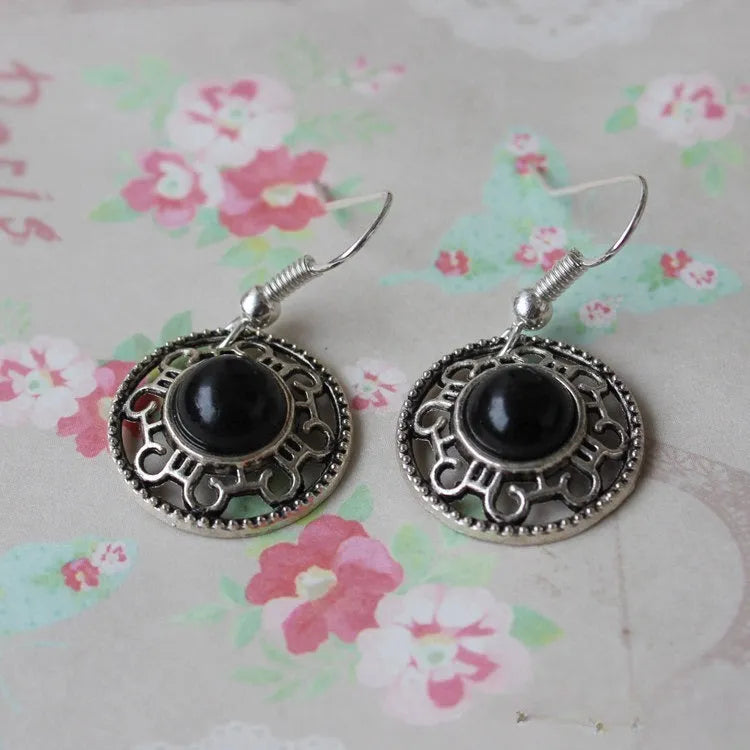 Geometric ethnic earrings with Tibetan silver and turquoise stones in traditional Miao style