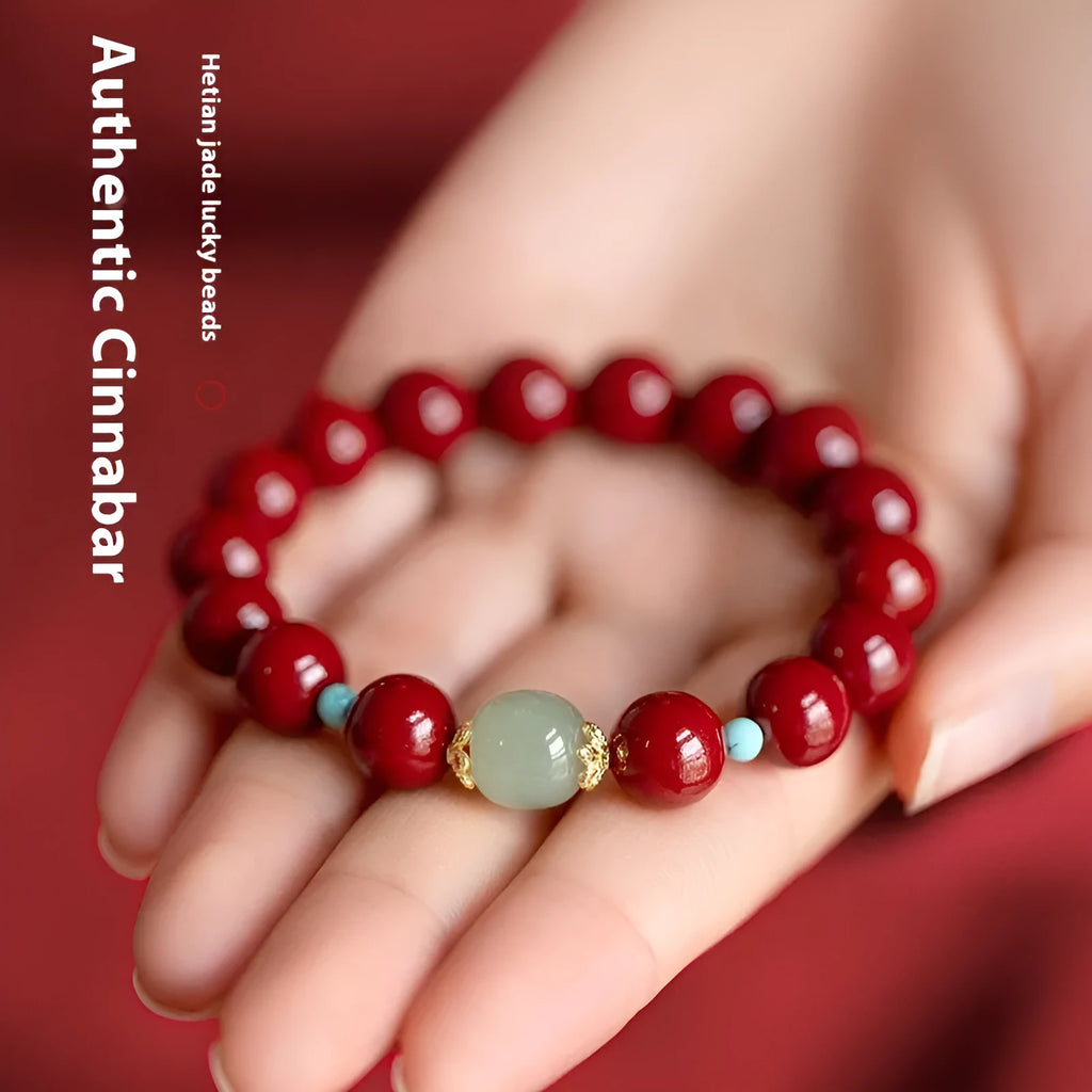 Purple gold sand cinnabar and Hetian jade geometric ellipse bead unisex bracelet on a wrist.