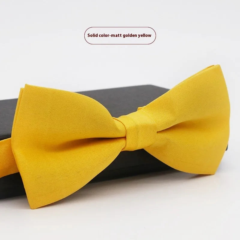 Solid colour polyester bow tie with flat head design measuring 12cm by 6cm