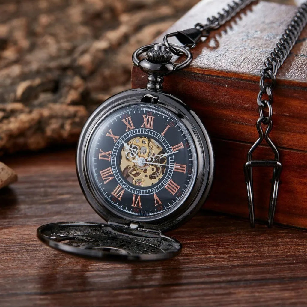 Retro hollow floral print mechanical pocket watch with transparent case back in gold colour.