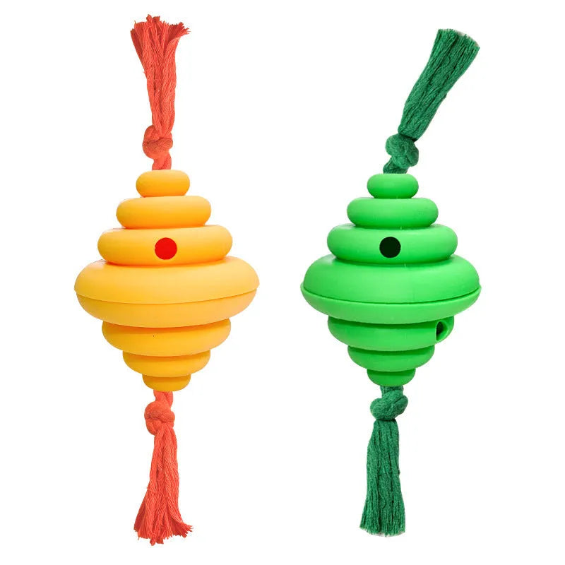 Green and yellow food-dispensing silicone dog ball with an attached rope for tug-of-war.