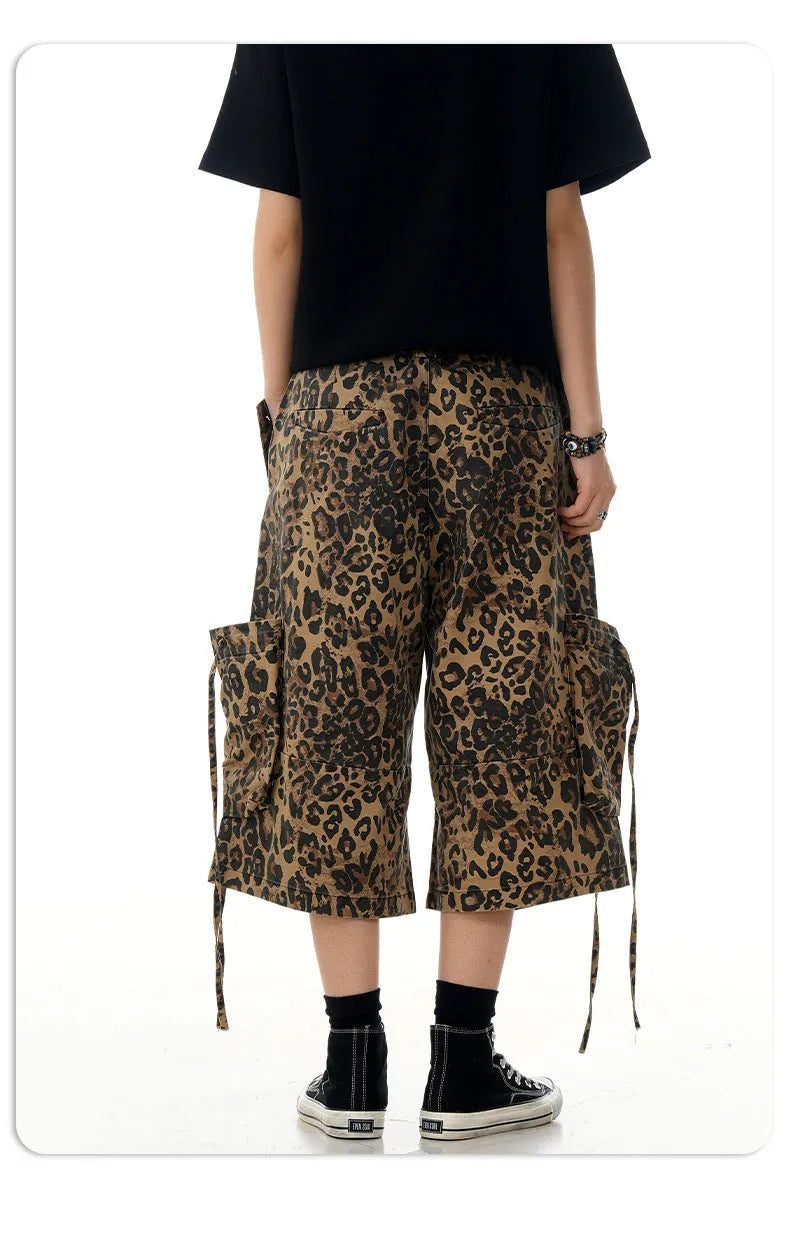 Women's loose straight cropped pants in a leopard print pattern with a high waist and button fly.