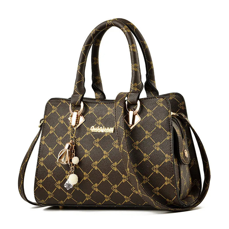 Women's geometric pattern print messenger bag in PU leather with zipper closure and internal organisers.