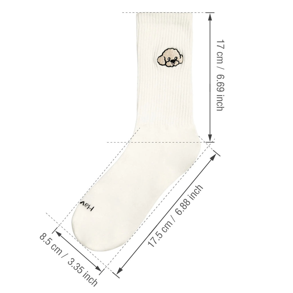 White cotton tube socks with printed Corgi dog pattern on a white background