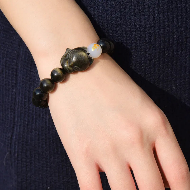 Natural obsidian zodiac bracelet in 10mm beads with national style design.