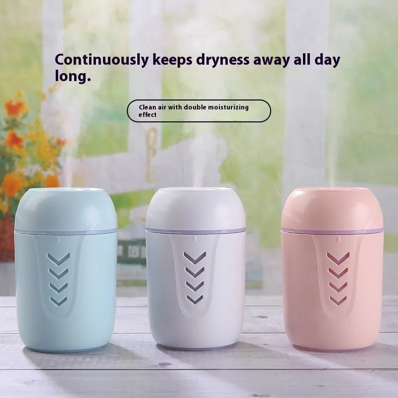 Compact round white portable air purifier with USB cable on a car dashboard and office desk.