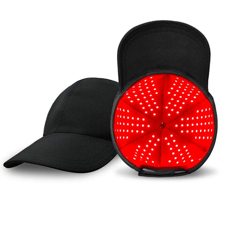 Black infrared peaked cap with 180 red LED lights for hair growth therapy on a stand.