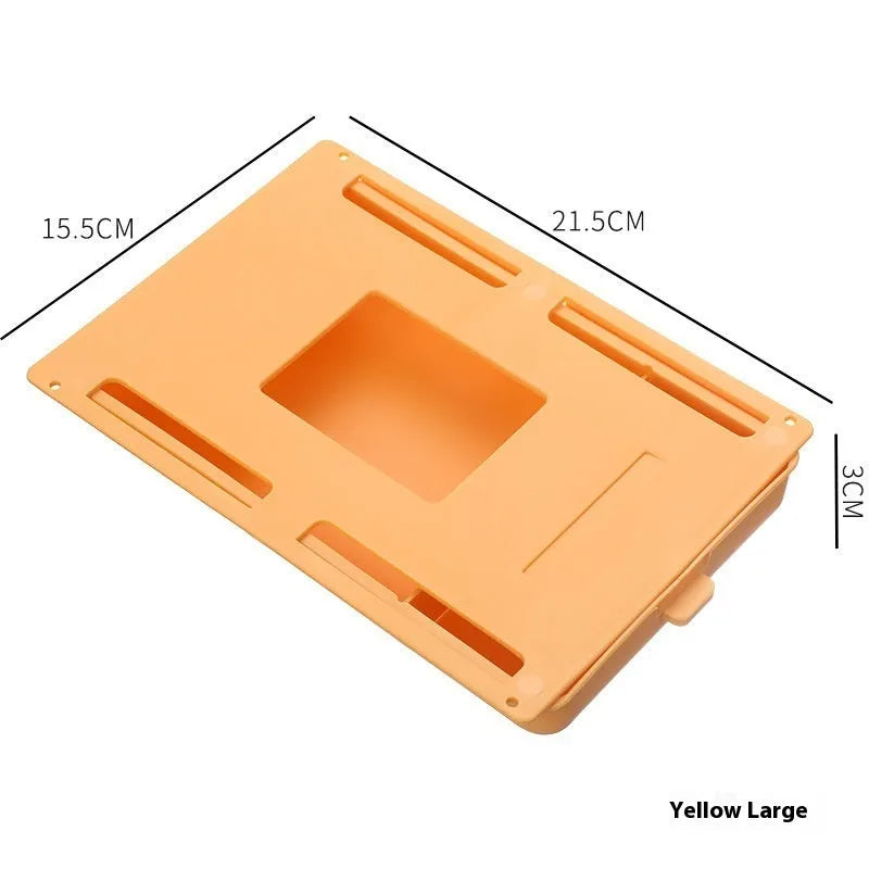 Small white plastic storage box with a grid pattern, shown adhered underneath a wooden table.