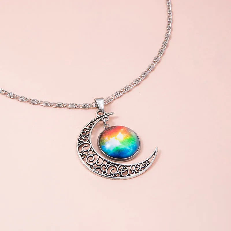 Silver hollow moon pendant necklace with glass star insert on Figaro chain for women