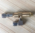 Set of three 1.0mm brass oil burner nozzles on white background