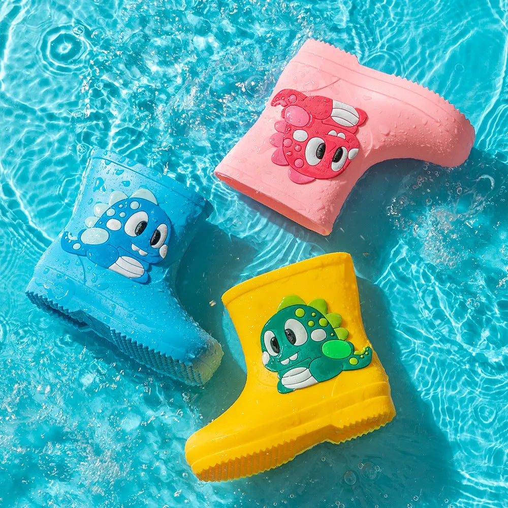 Children's cute waterproof PVC rain boots with cartoon dinosaur pattern in blue, pink, and yellow