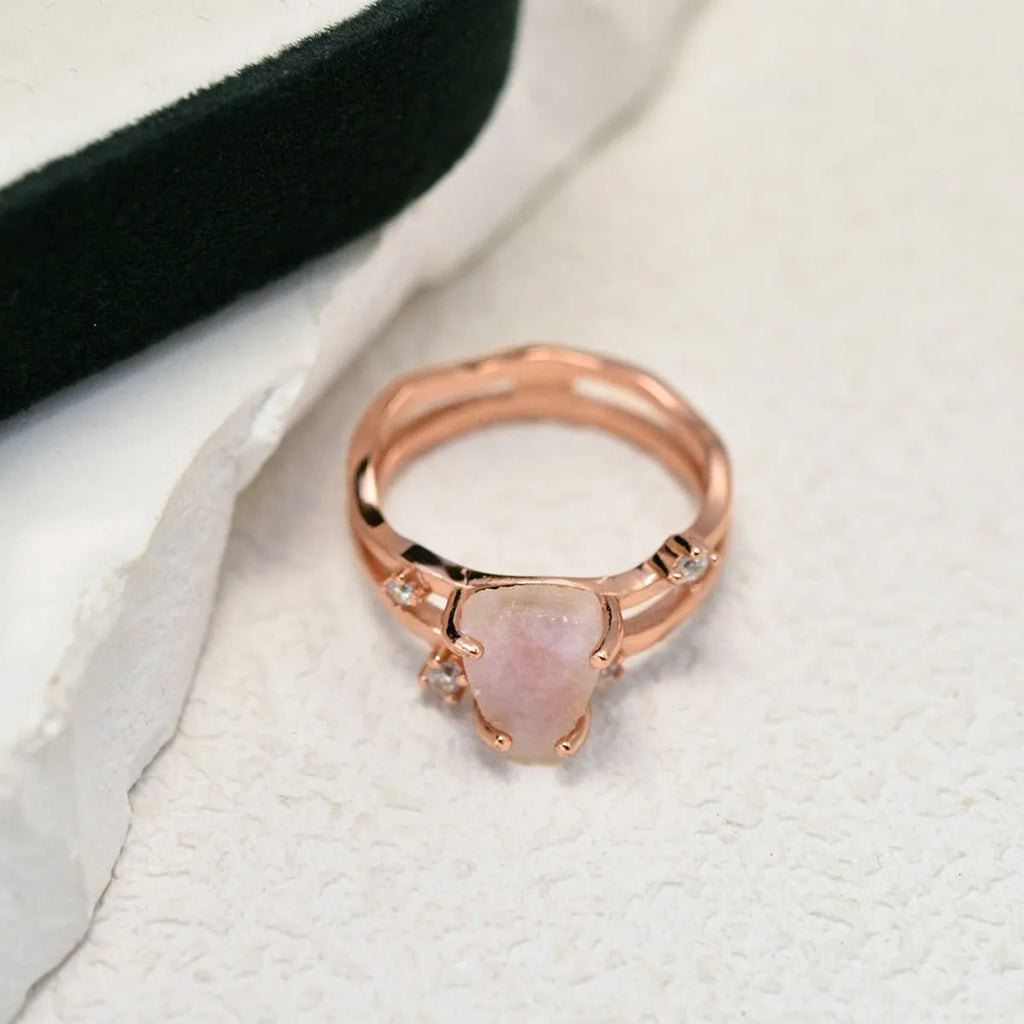 S925 silver geometric ring with irregular triangle shape and central moonstone on a model's hand.
