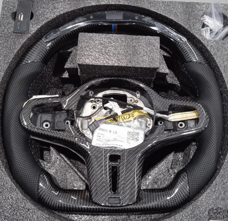 Black carbon fibre BMW steering wheel with LED display and heating controls
