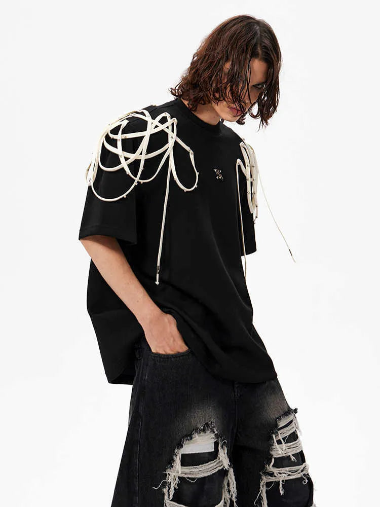 Black loose fit t-shirt with ribbon detailing on padded shoulders, short sleeves, round neck