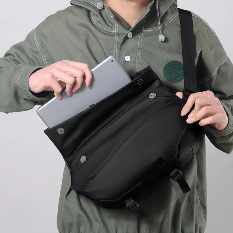 Grey medium-sized PU leather crossbody sling bag for men with a horizontal square shape.