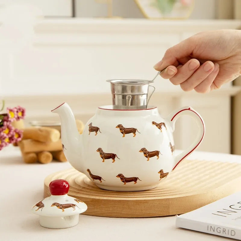 Ceramic sausage dog teapot mug cup and saucer three-piece set on table