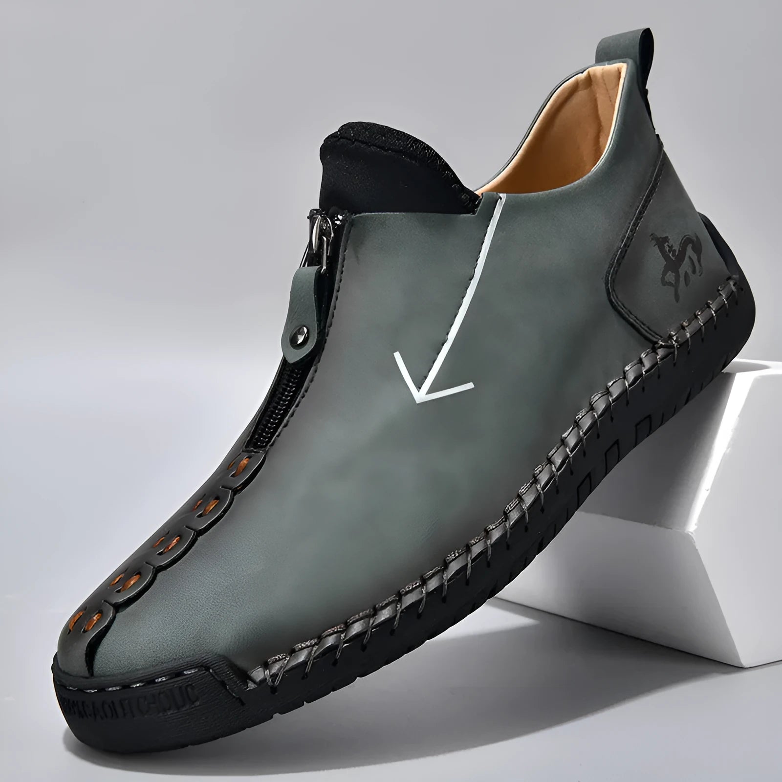 Men's black leather zip-up boots with round toe and hand-stitched rubber sole on a white background.