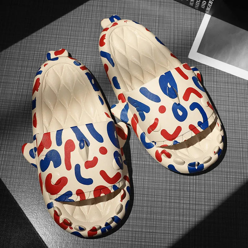 Beige and black EVA open-toe home slippers with a shark design on the front, shown as a couple's pair.