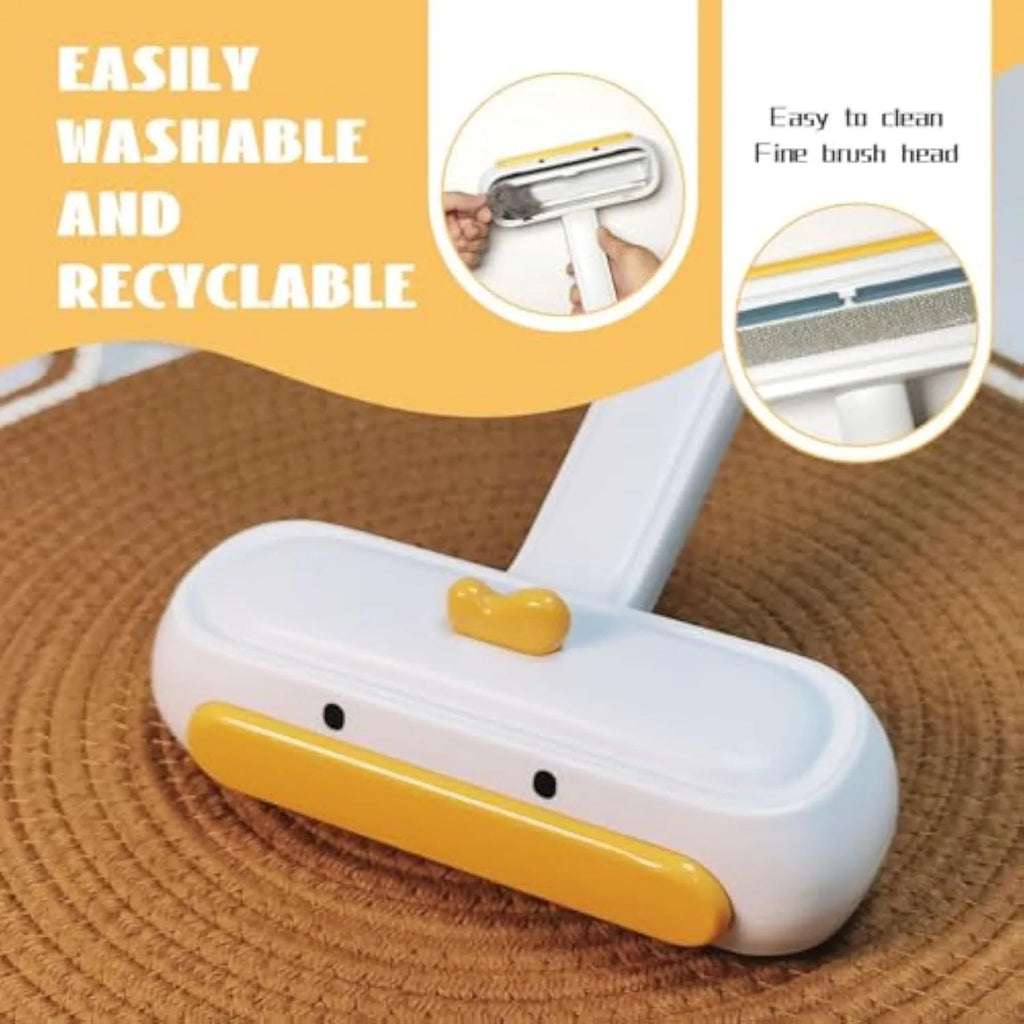 White portable pet hair remover roller with a yellow cartoon duck design on a table.