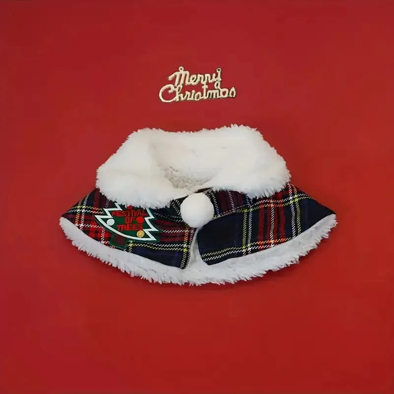 Polyester pet scarf cloak on a dog, showing a red background with a festive snowflake bell design.