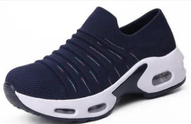 Women's fly-knit stretch sock shoes in light grey with low heel and round toe.