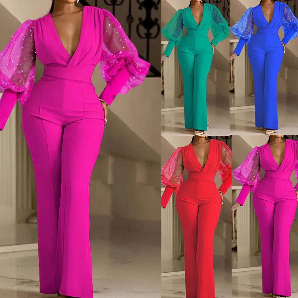 Red women's jumpsuit with mesh stitching on long sleeves, slim fit bodice, wide legs, and elastic waist.