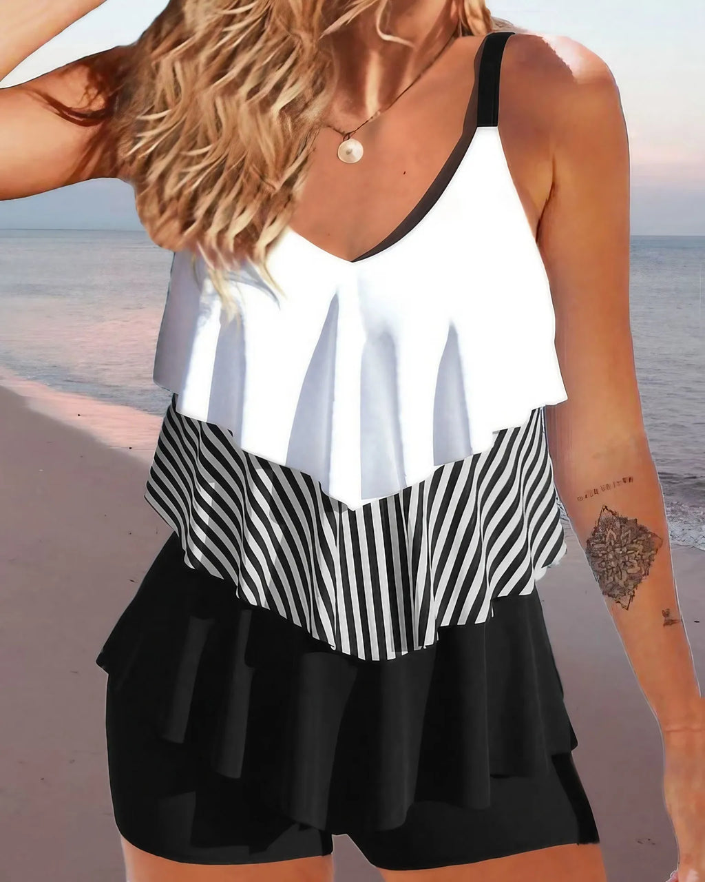 Women's backless spaghetti-strap bikini swimsuit with ruffle detail in a floral print.