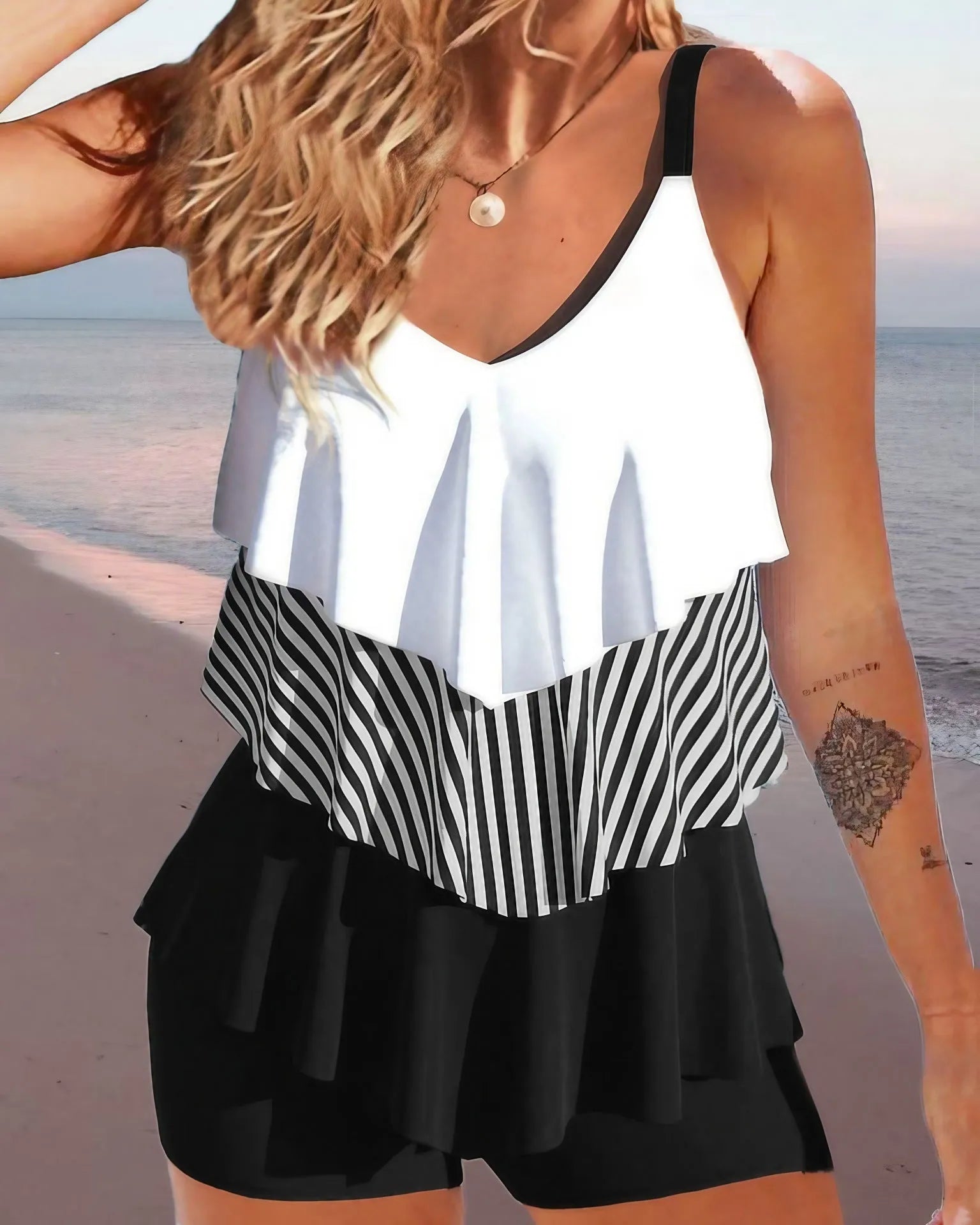 Women's backless spaghetti-strap bikini swimsuit with ruffle detail in a floral print.