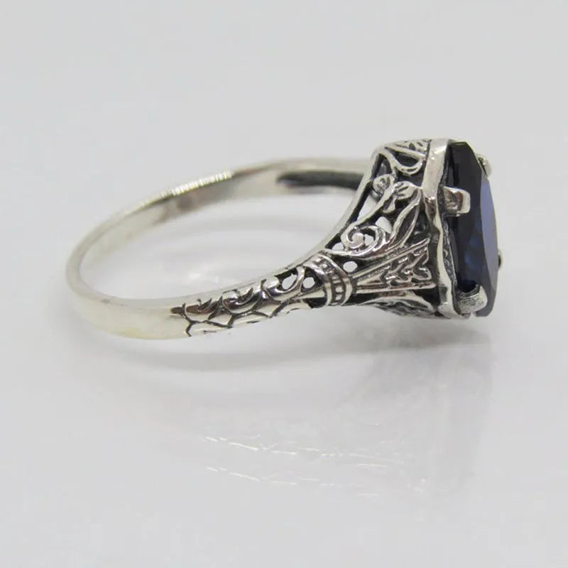 Women's geometric hollow ring in silver electroplated alloy showing openwork pattern