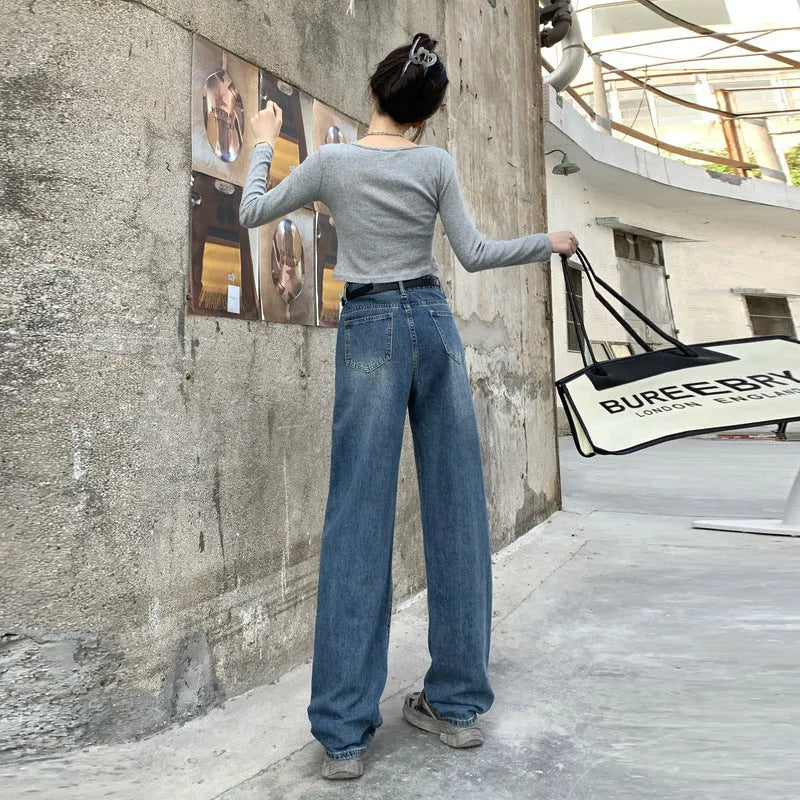 A pair of women's retro blue high-waisted straight-leg jeans laid flat, showcasing the classic five-pocket design.