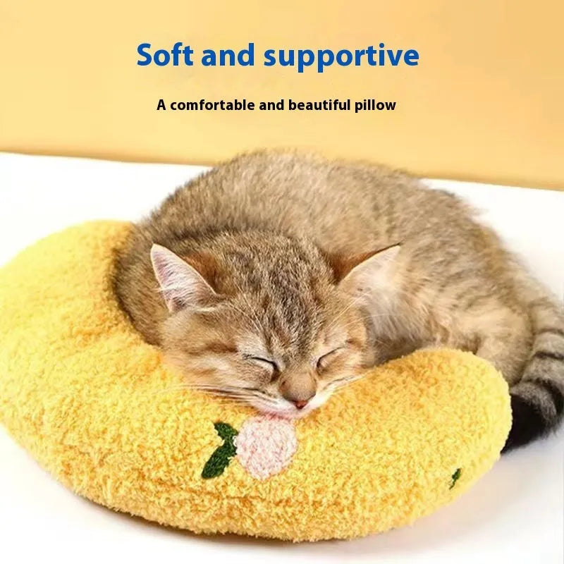 Blue U-shaped cat pillow with a question mark design on a white background