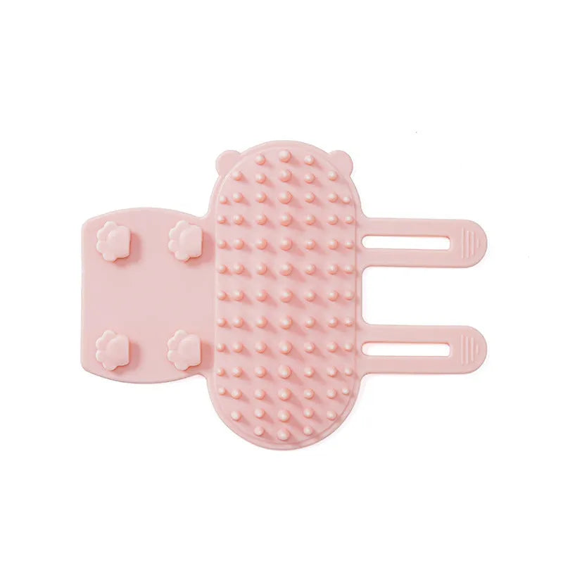 Silicone pet massage comb with adjustable strap attached to table leg