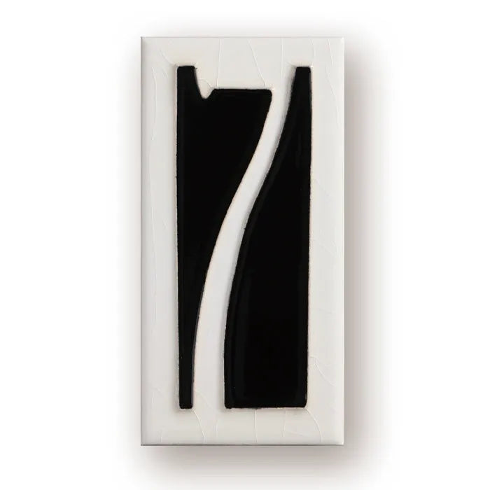 Handmade retro enamel ceramic doorplate showing a number on a glossy surface