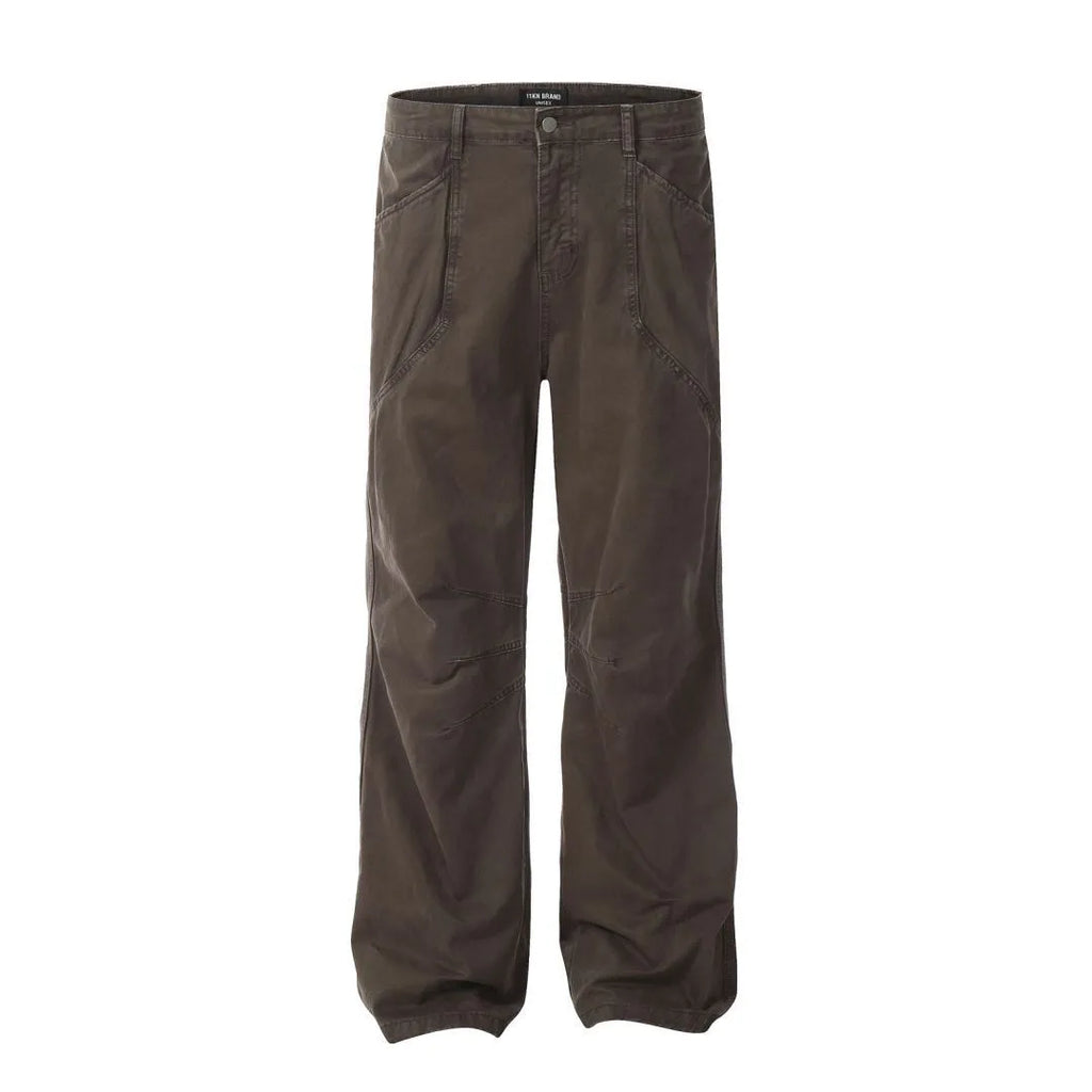 Man wearing brown loose fit high-waist straight leg cotton jeans trousers