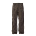 Man wearing brown loose fit high-waist straight leg cotton jeans trousers